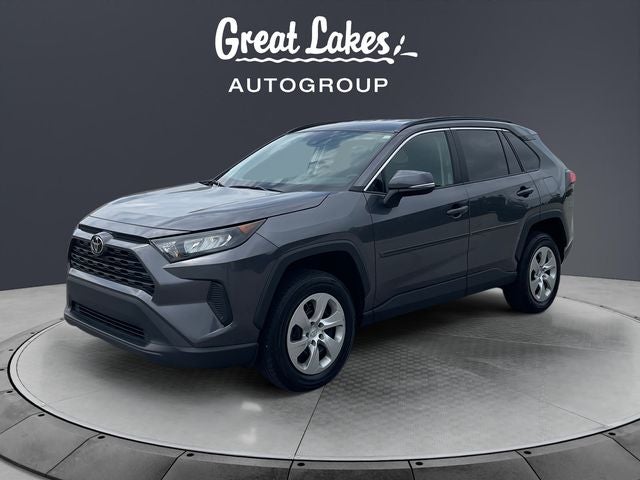 2021 Toyota RAV4 LE in Magnetic Gray Met. — front three-quarter view